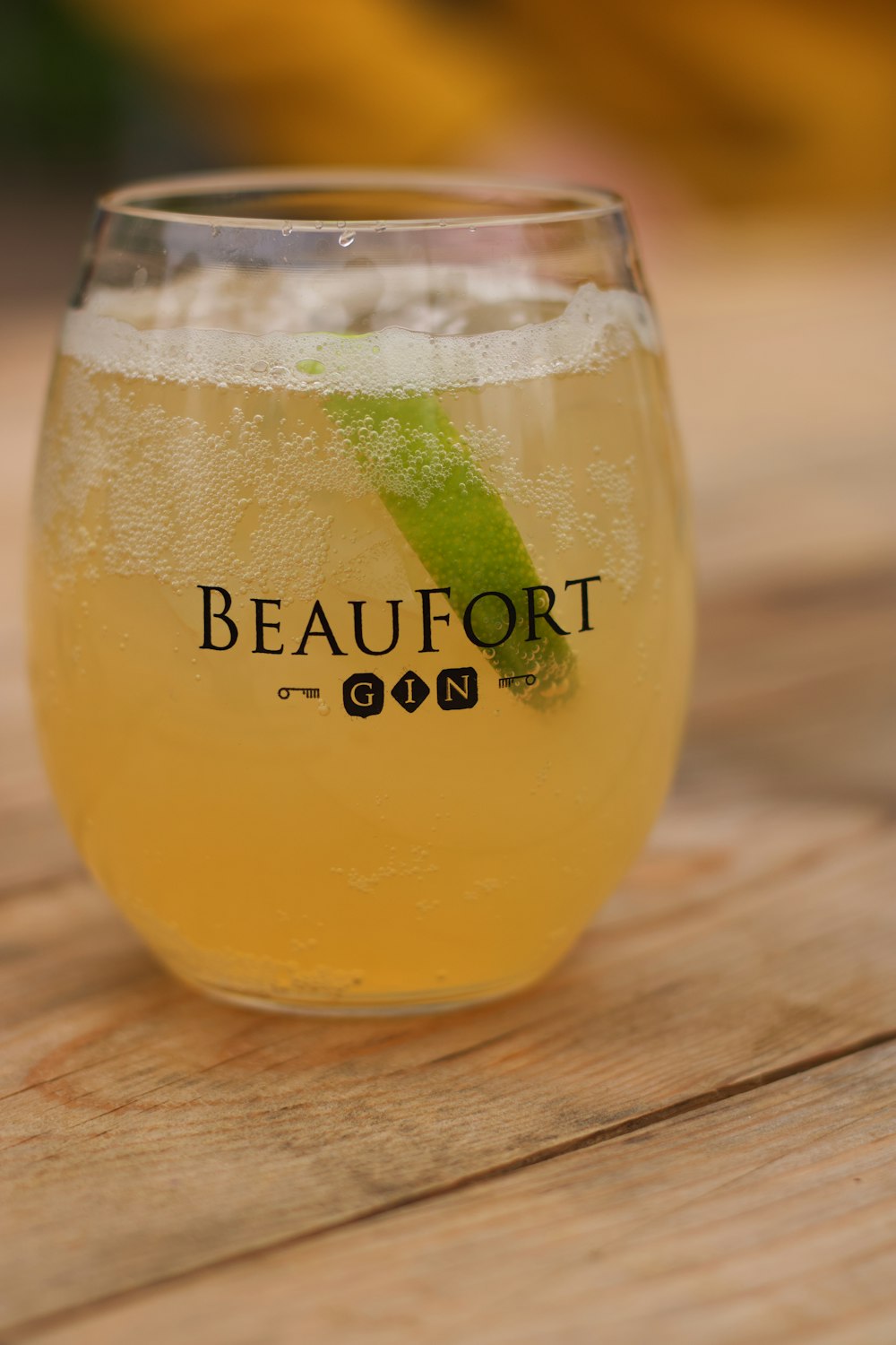 clear glass bottle with yellow liquid