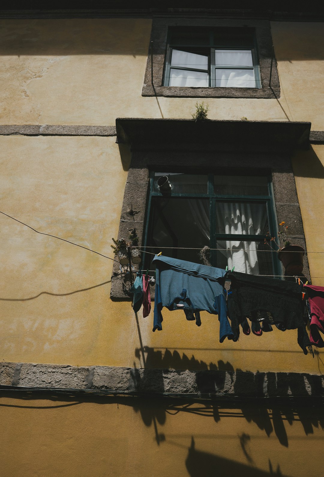 clothes hanged on string near window