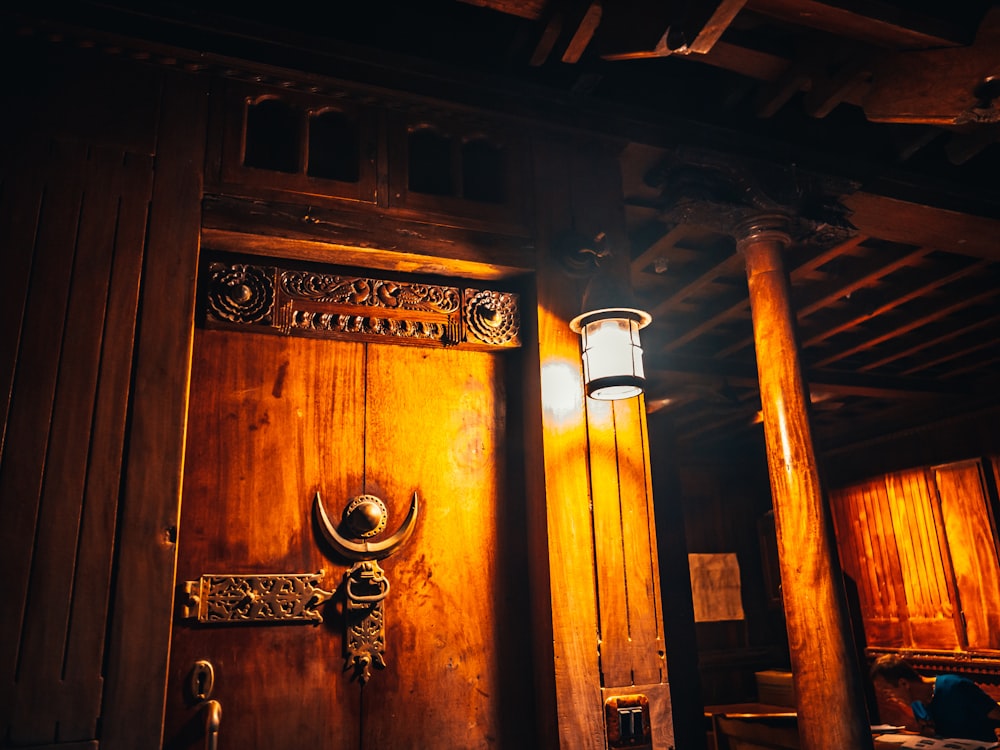 brown wooden door with black steel door lever