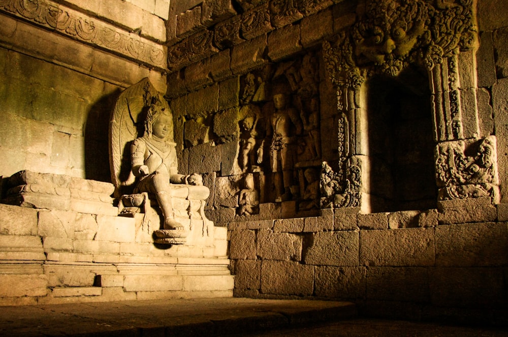 gray concrete statue of man and woman