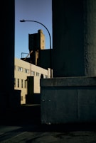 Wide shot of a commercial building exterior with protective coatings applied, gleaming under sunlight.