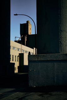 Wide shot of a commercial building exterior with protective coatings applied, gleaming under sunlight.