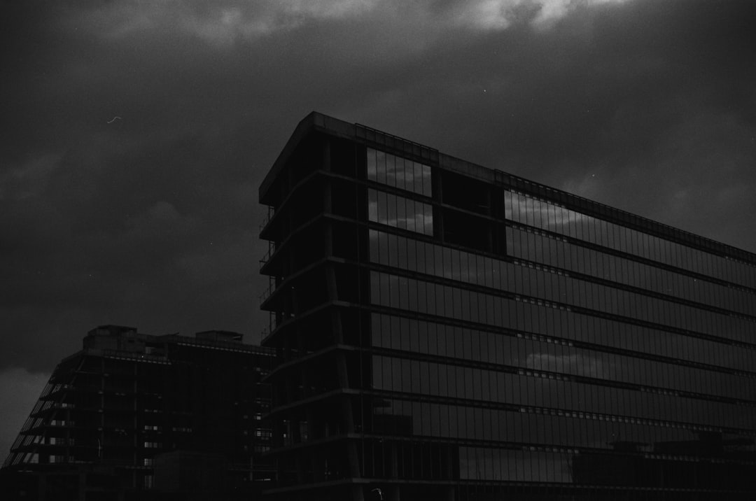 grayscale photo of high rise building,