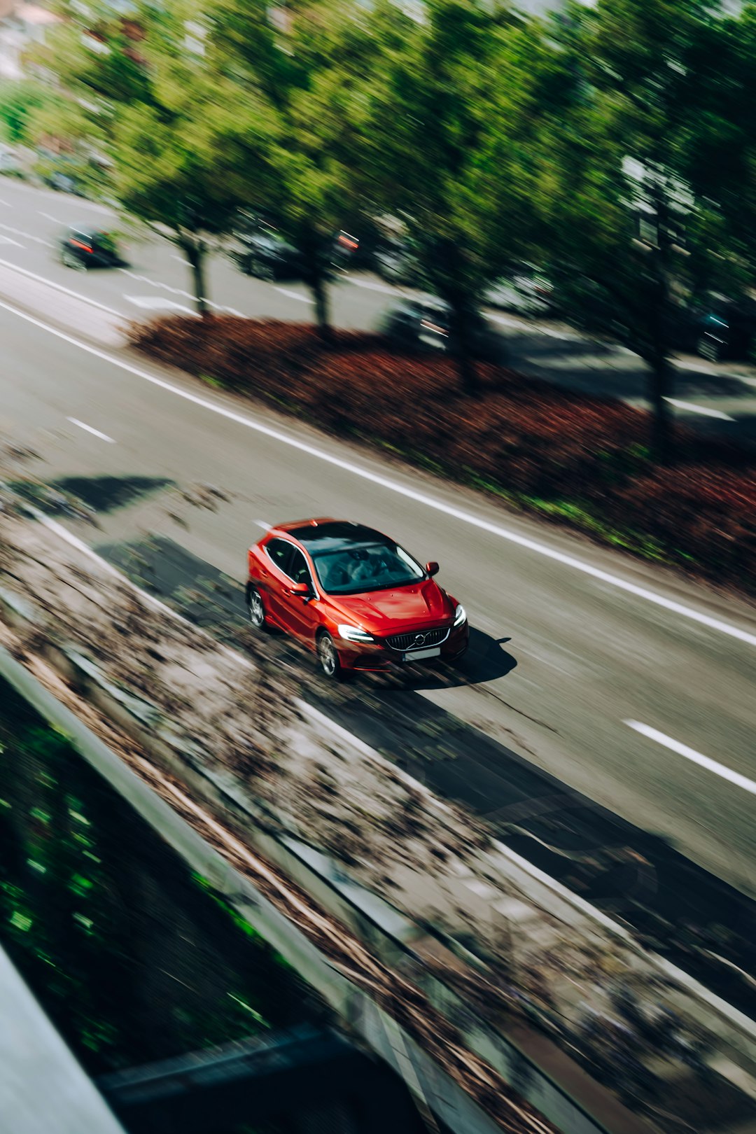 red car on the road