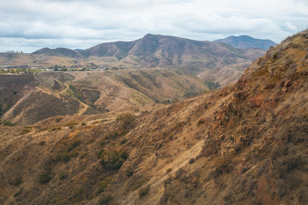 brown and green mountains under blue sky during daytime