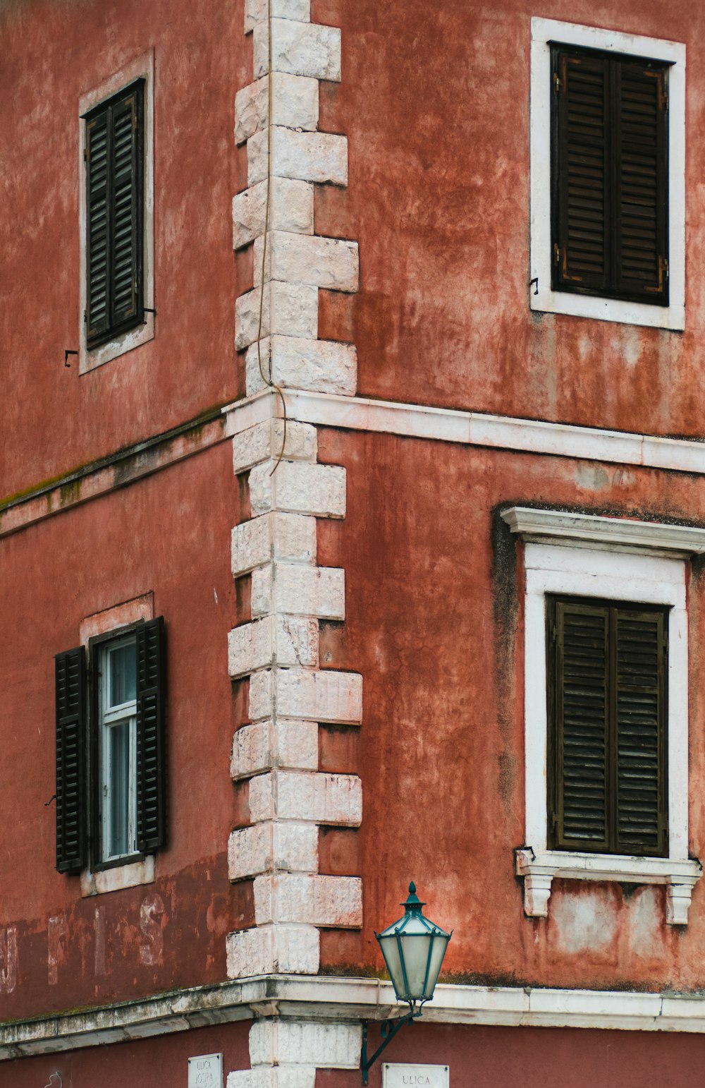 brown brick building with windows