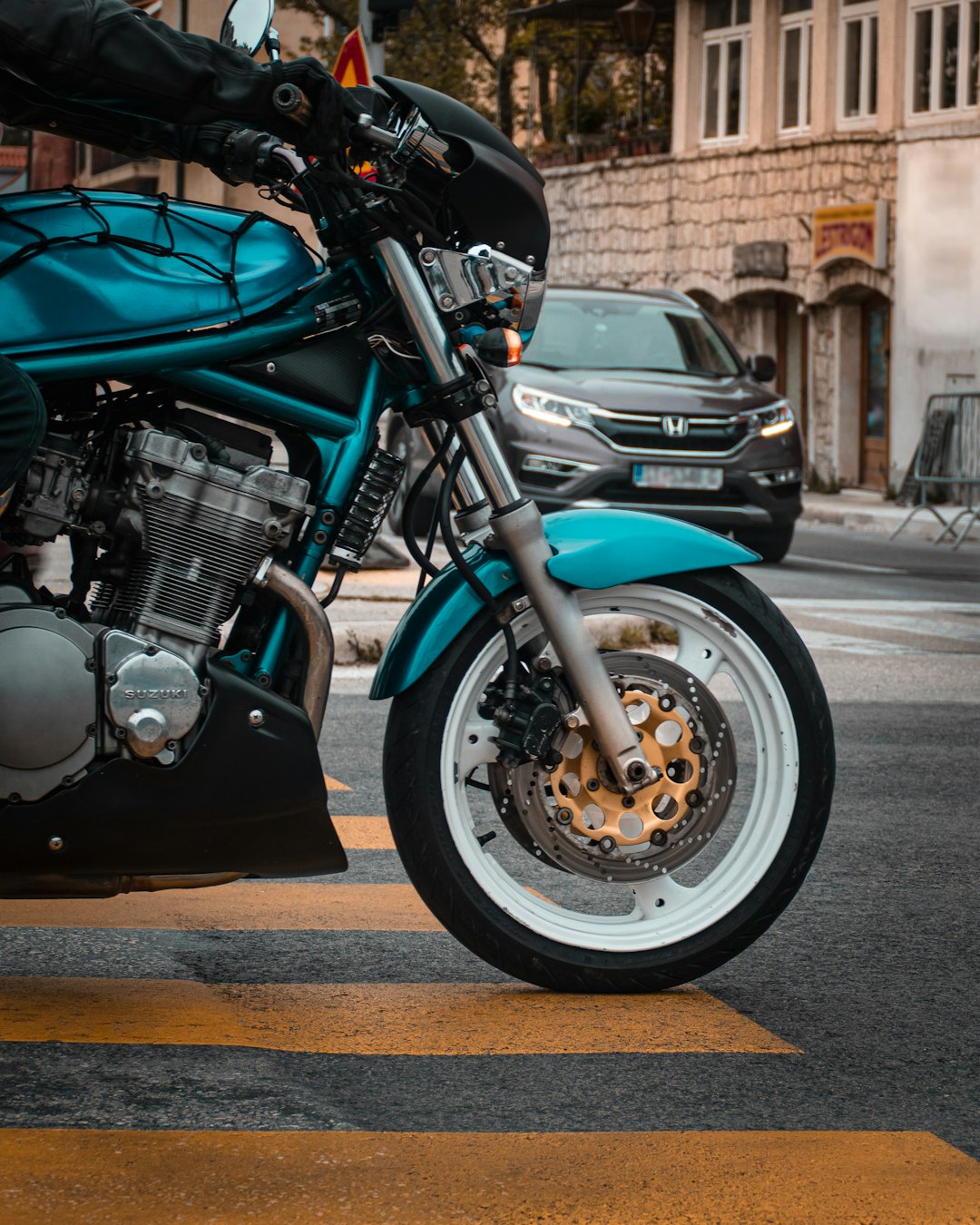 black and blue motorcycle on road during daytime