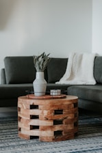 A cozy living room featuring a sleek sofa and wooden coffee table from brespree llc.