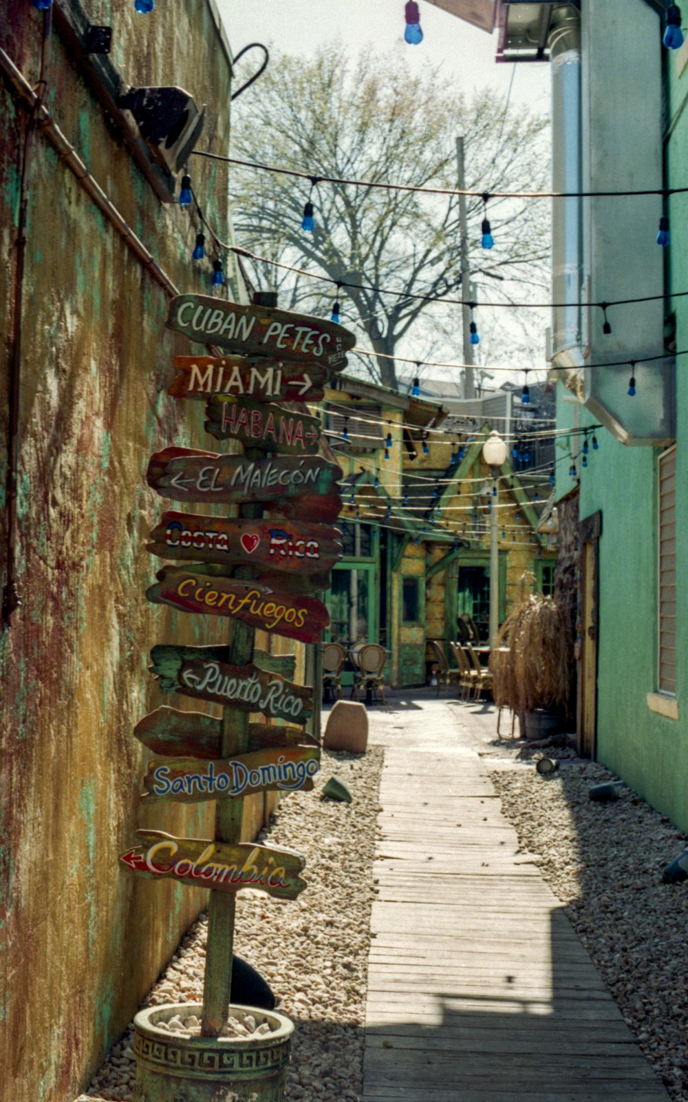 brown wooden signage on brown wooden wall