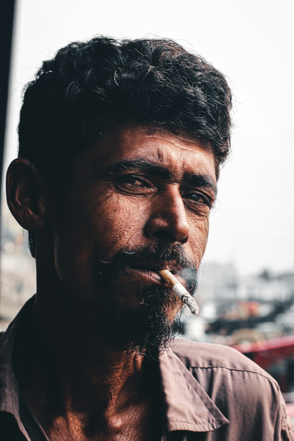 man smoking cigarette during daytime