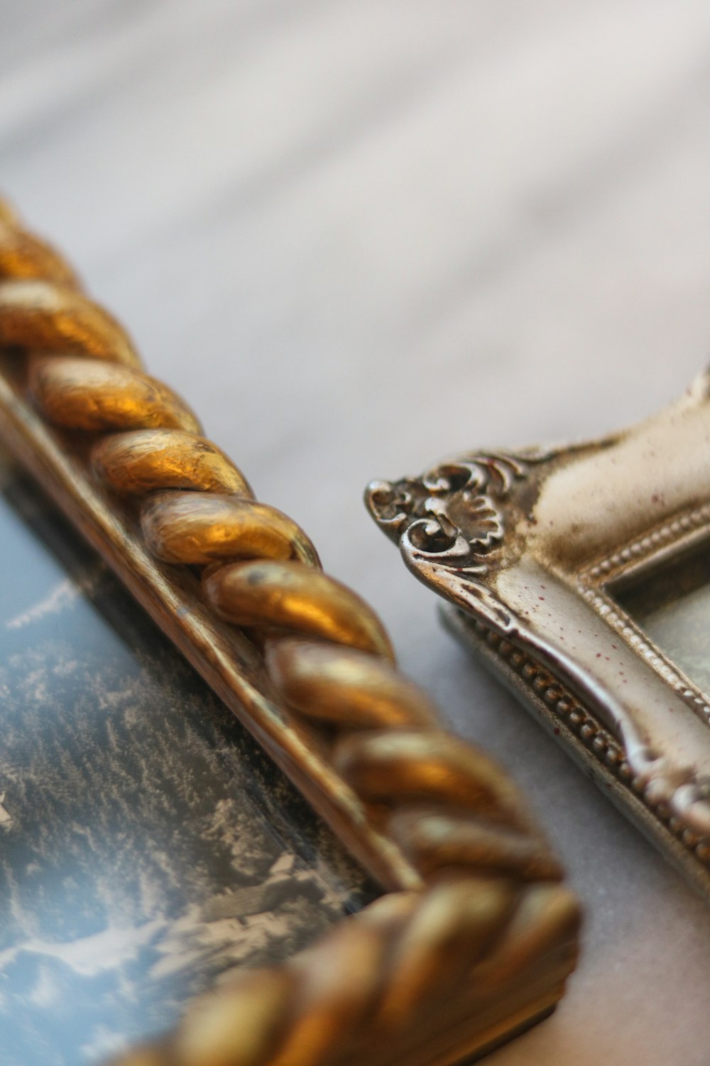 gold diamond studded ring on white textile