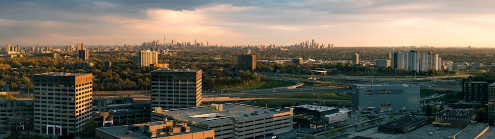 city buildings under white clouds during daytime