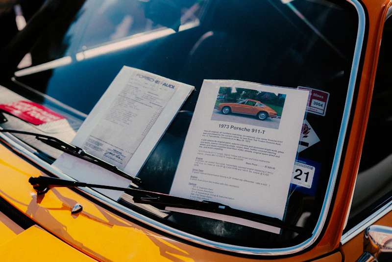 Car documents and paperwork on a dashboard