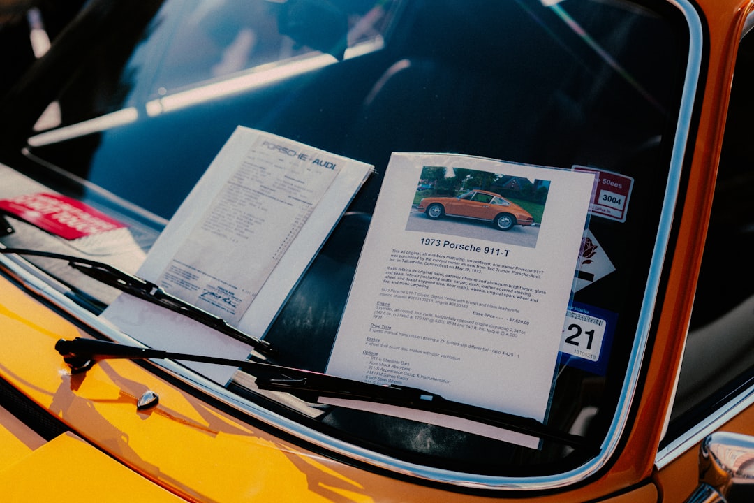 white printer paper on yellow car