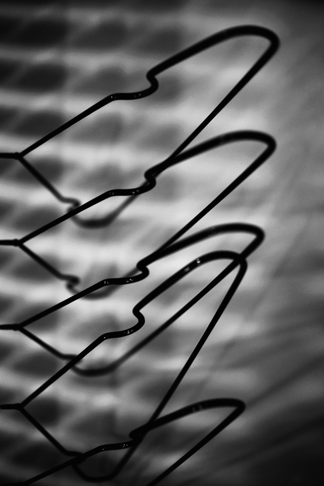 black metal wire in grayscale photography