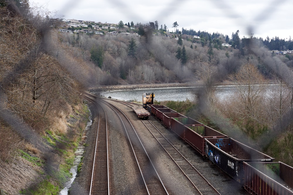 brown train on rail road during daytime