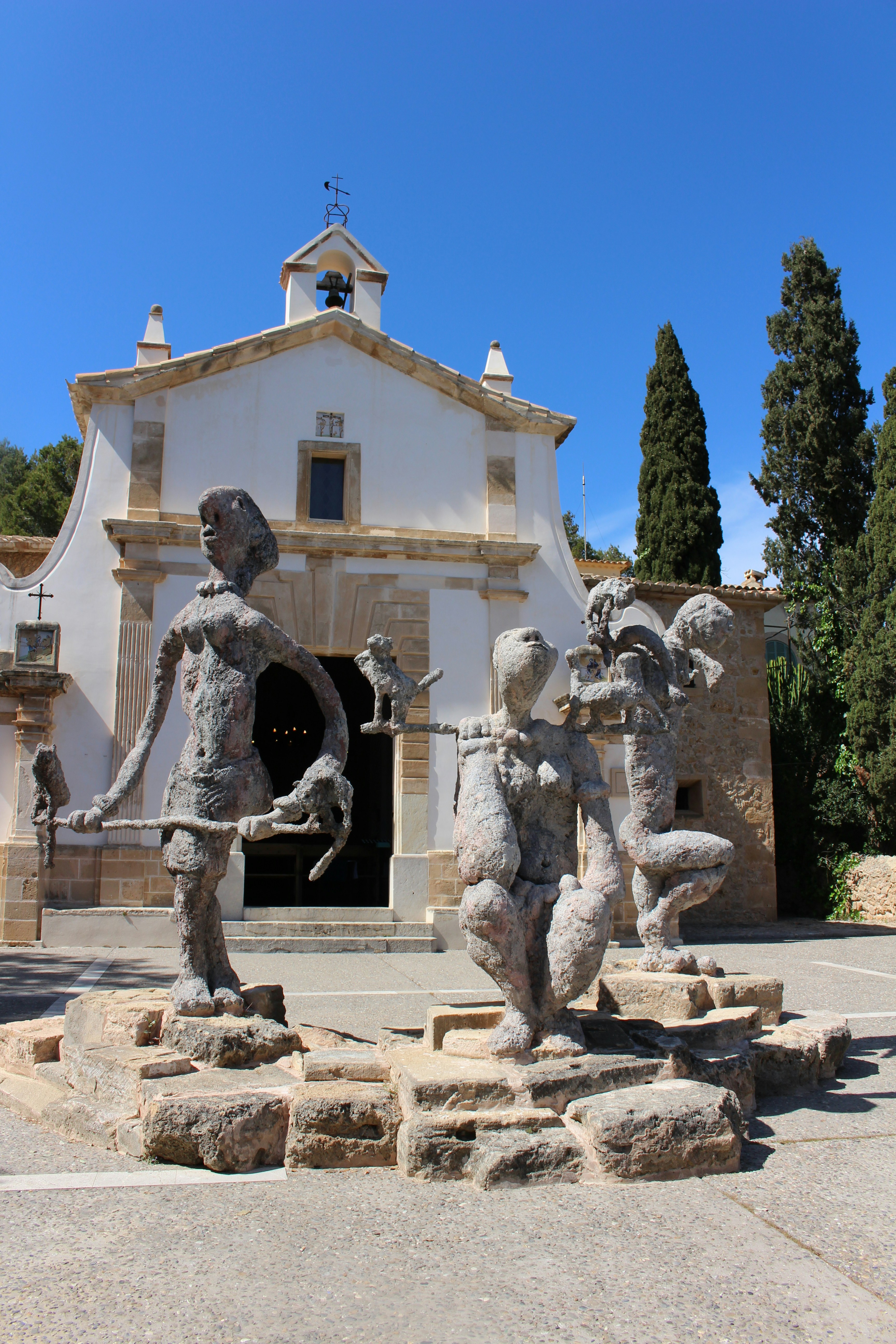 man in black jacket and pants statue