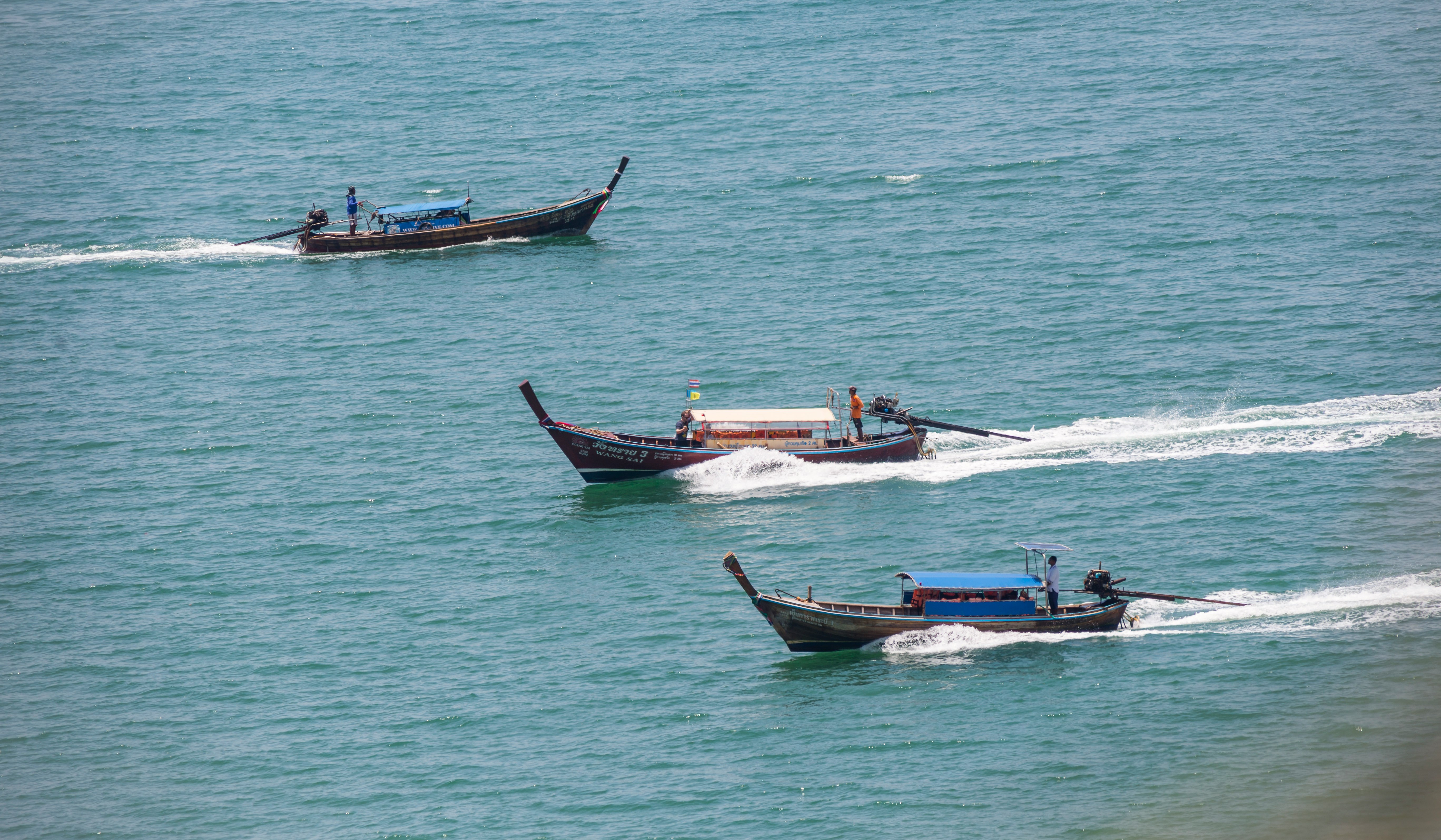 brown boat on sea during daytime