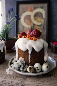white and brown cake with strawberry on top