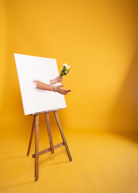 woman in white dress sitting on brown wooden seat
