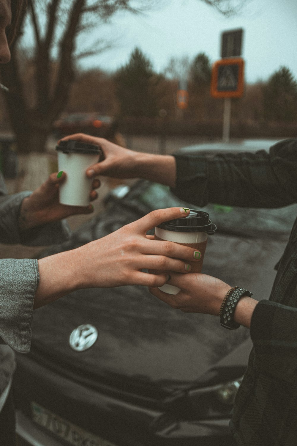 person holding white ceramic mug