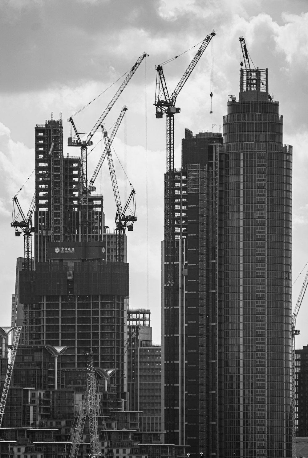 grayscale photo of high rise buildings