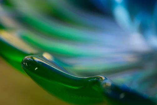 Close-up of a detailed 3D printed sculpture with smooth curves and vibrant colors.