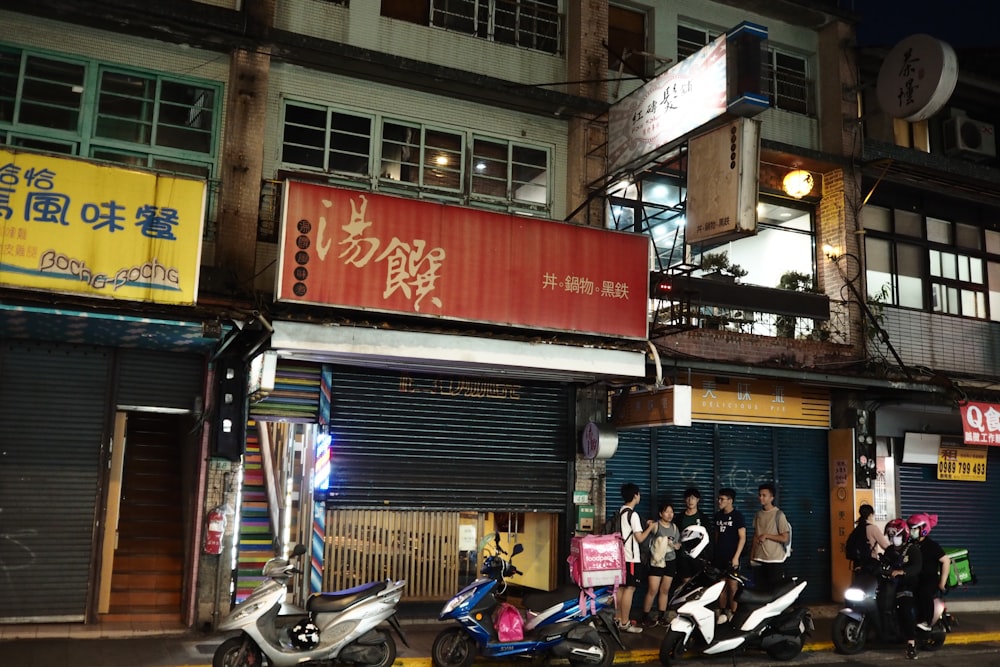 people sitting on black motorcycle during daytime