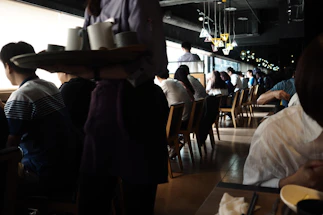 people sitting on chair in restaurant