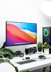 black flat screen tv turned on near black headphones