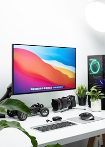 black flat screen tv turned on near black headphones