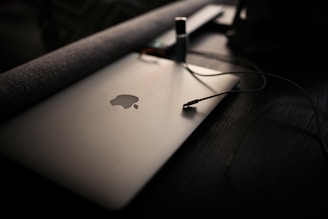 macbook pro on brown wooden table