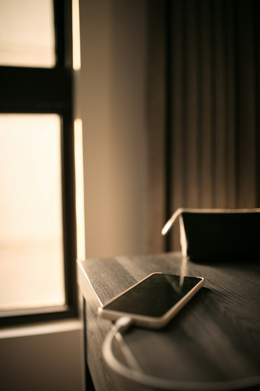 black and white book on brown wooden table