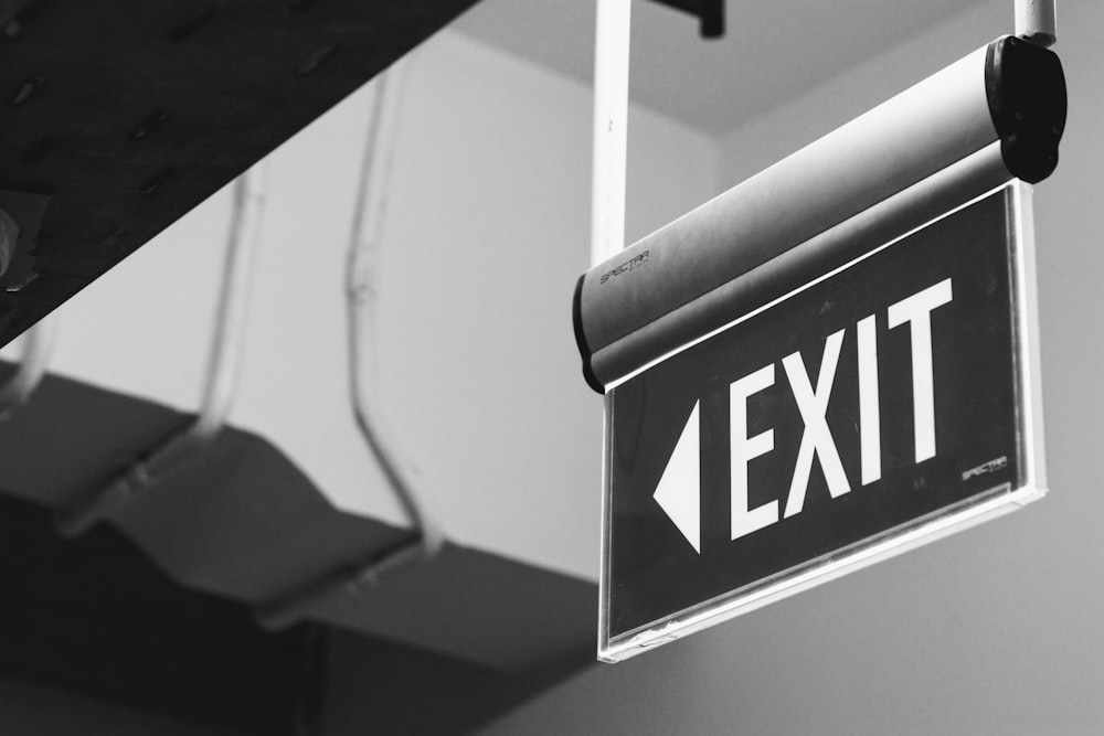 grayscale photo of a black and white arrow sign