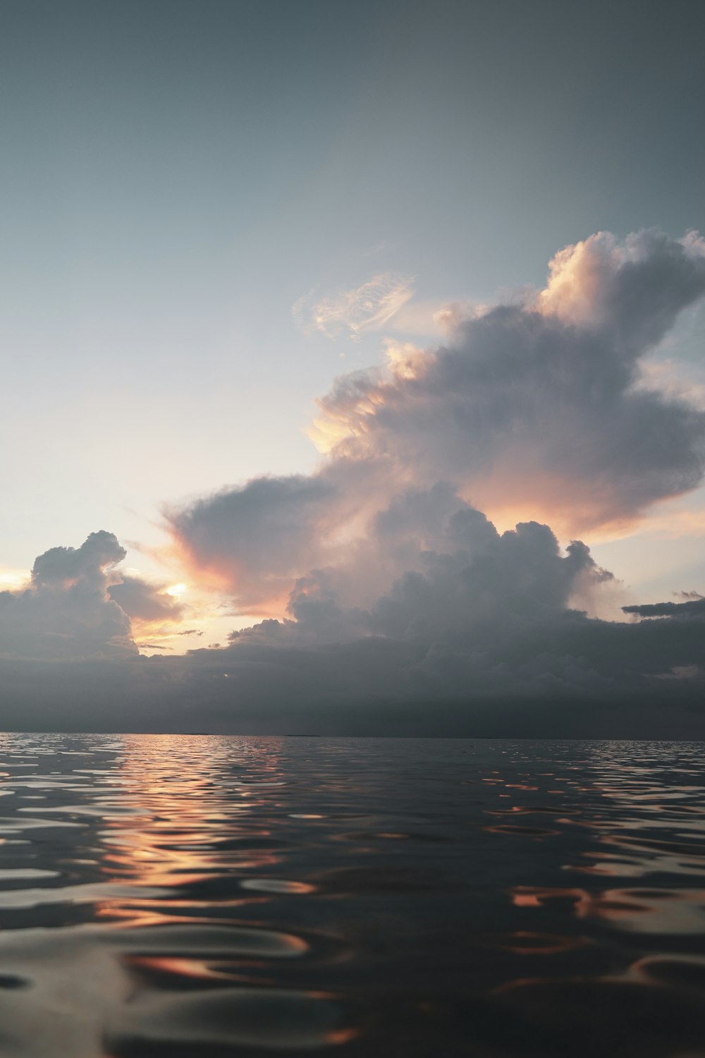 body of water under cloudy sky during daytime