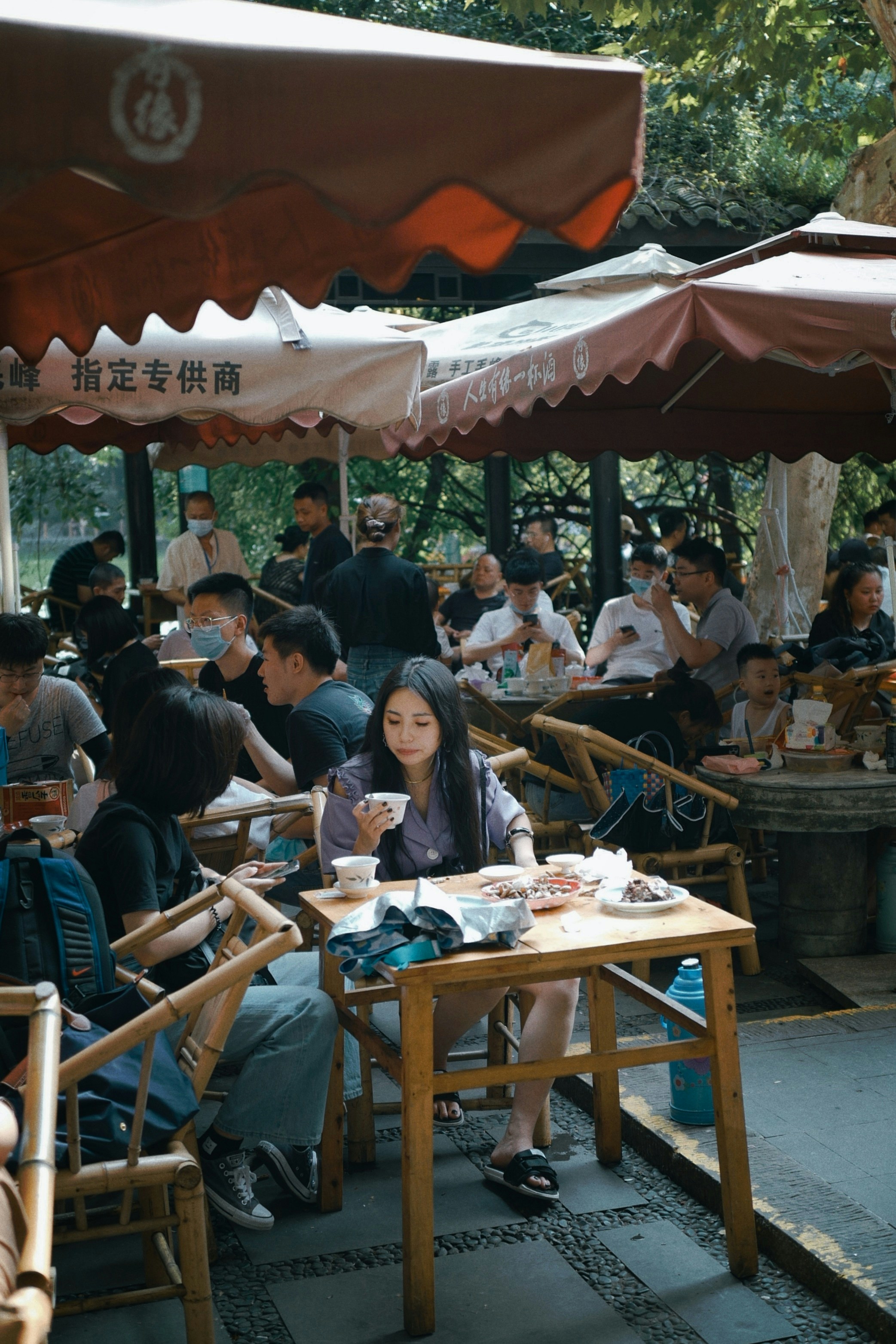 A lively outdoor venue with people enjoying after work gatherings.