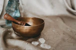 brown wooden bowl on white textile