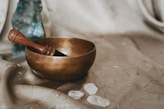 brown wooden bowl on white textile