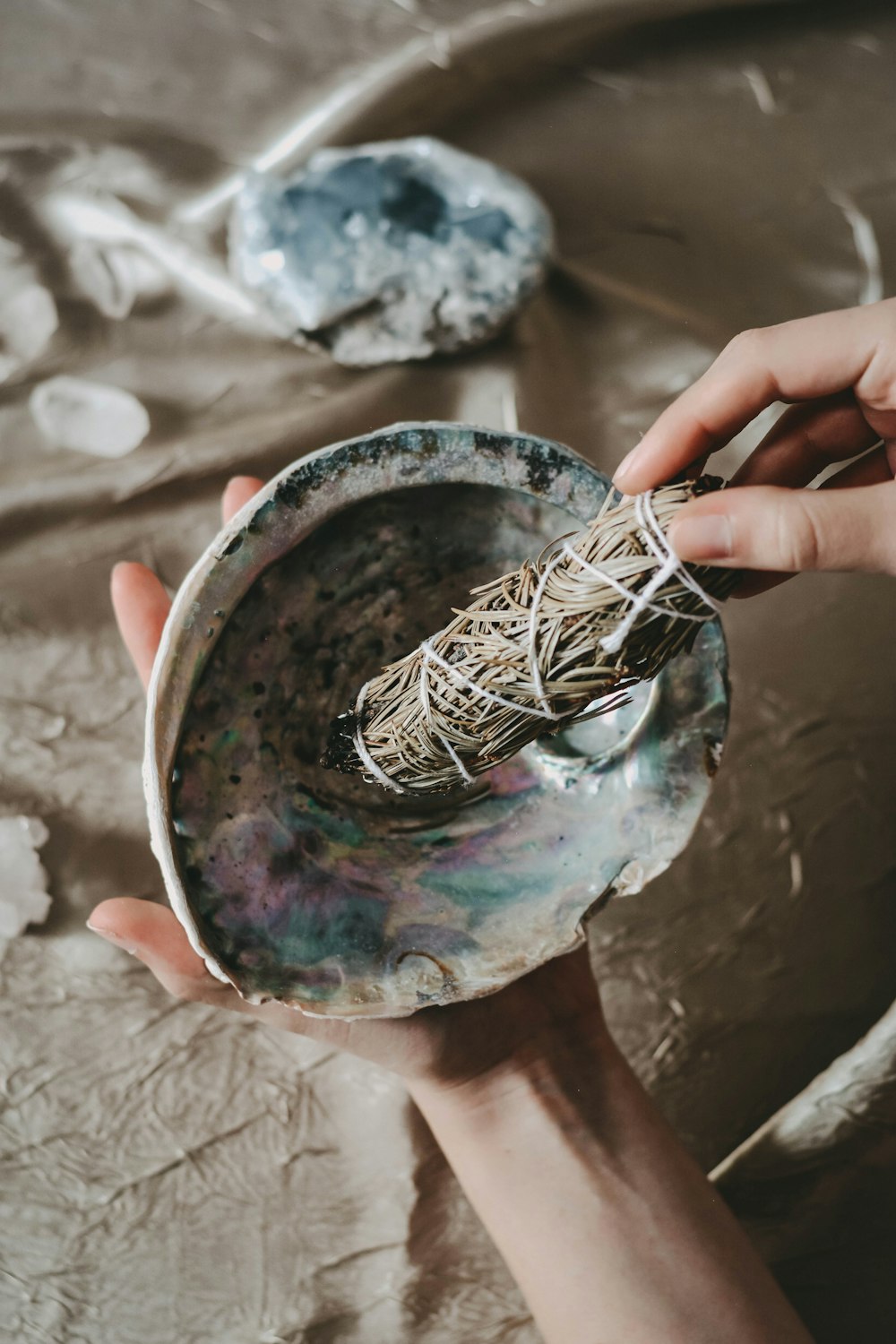 person holding blue and brown paint