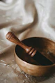 brown wooden spoon on brown wooden bowl