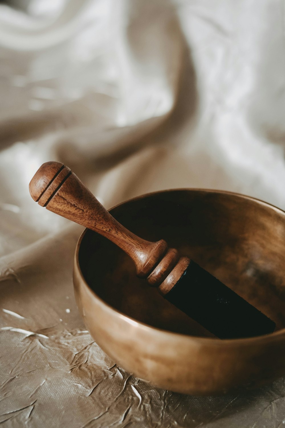 brown wooden spoon on brown wooden bowl
