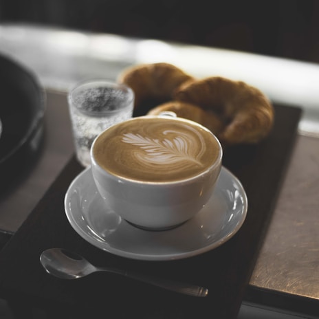 white ceramic cup with saucer