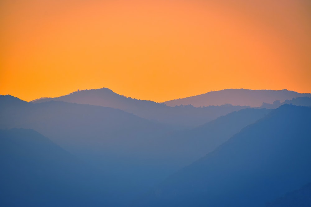 silhouette of mountains during sunset