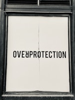 A bold headline displayed on a large screen with gold and red highlights glowing against a black background.