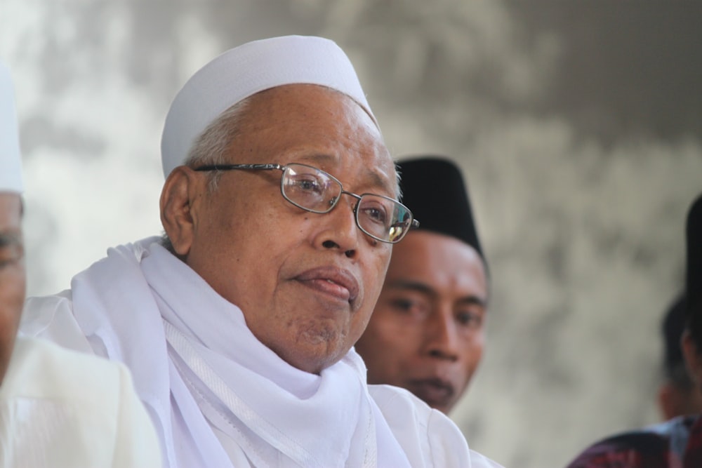 man in white thobe wearing eyeglasses