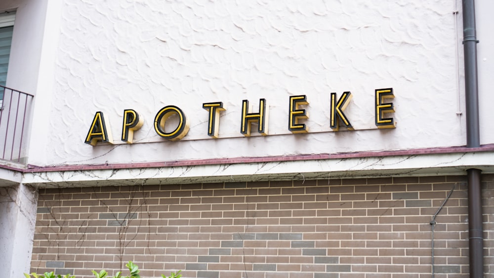 a brick building with a sign that says apothee