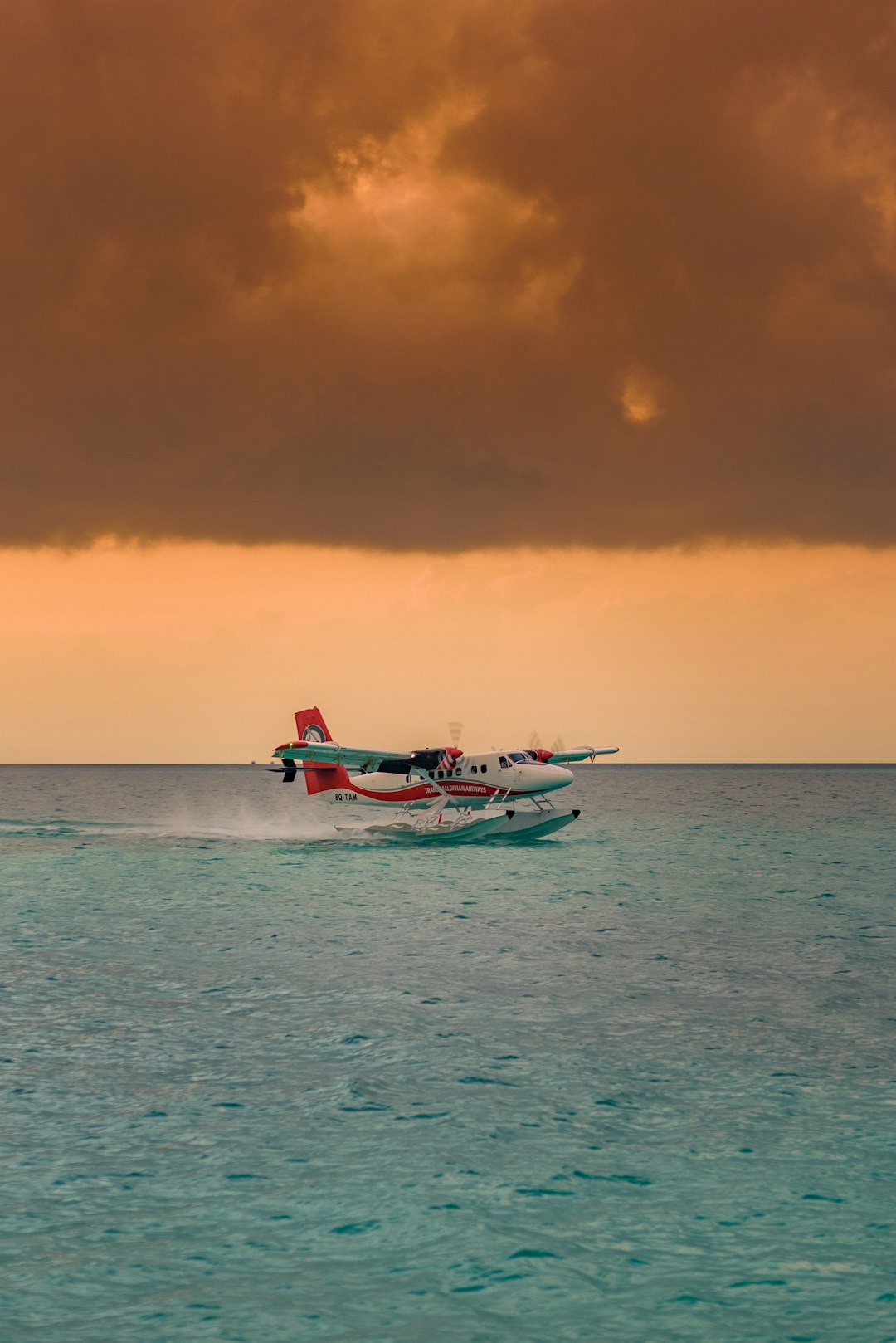 white and red boat on sea during daytime