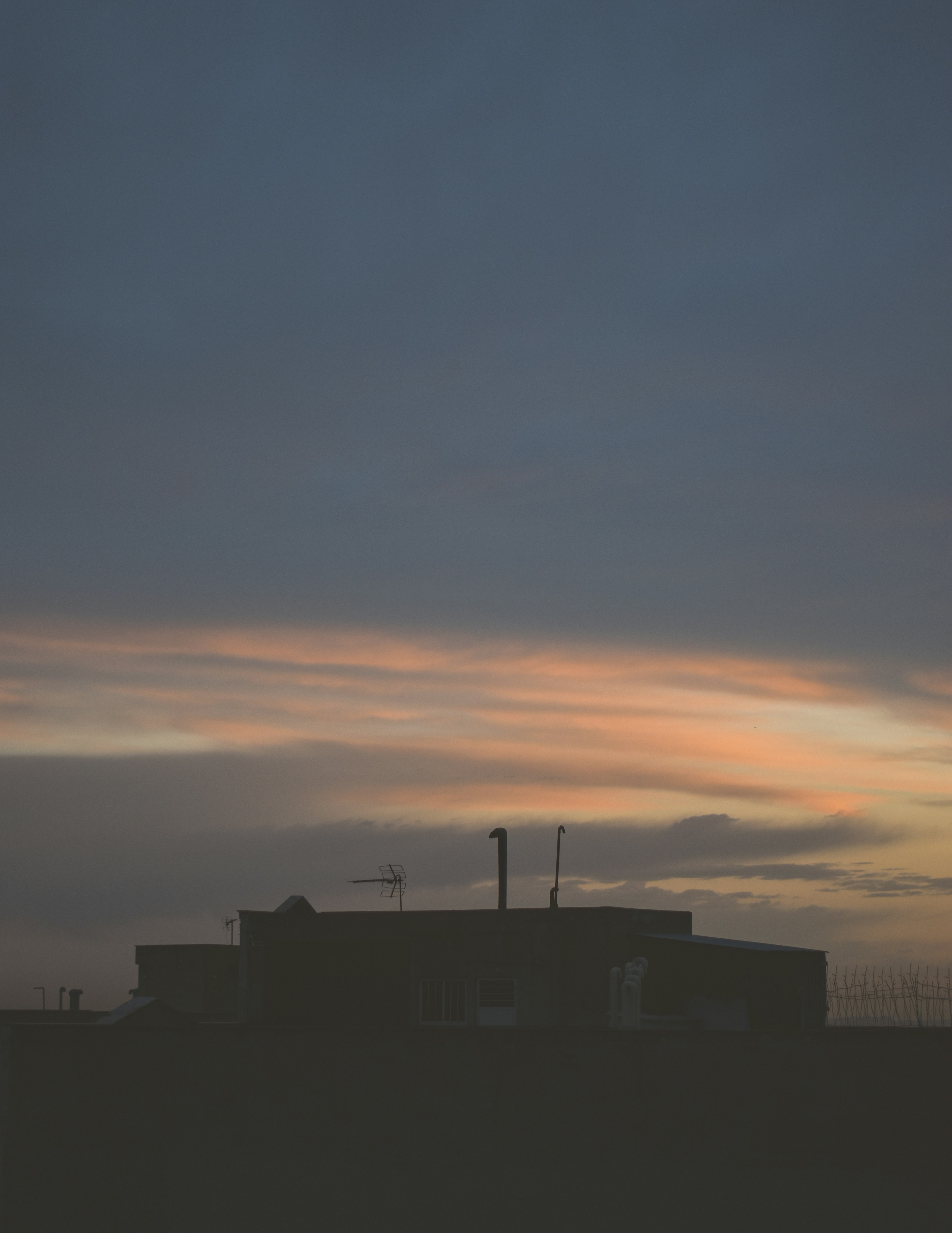 silhouette of building during sunset