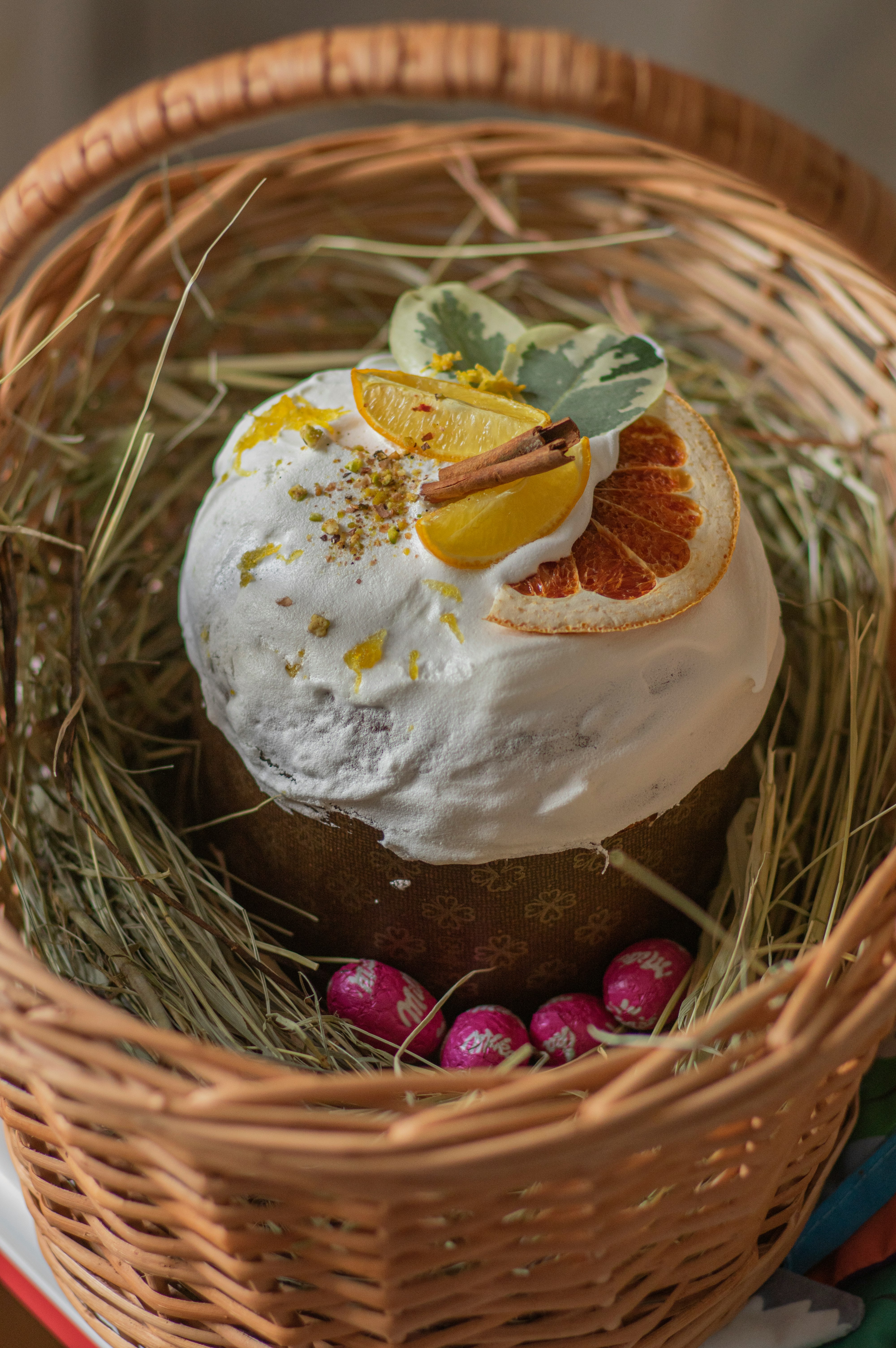 white and brown cake on brown wicker basket