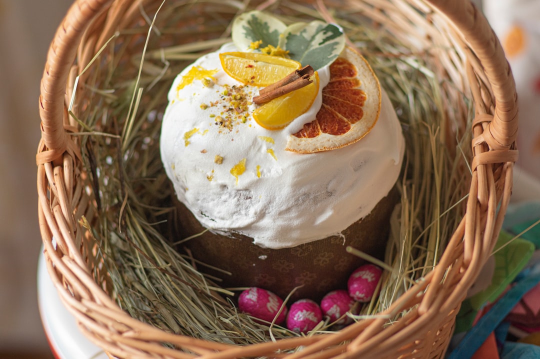 white and brown cake on brown woven basket